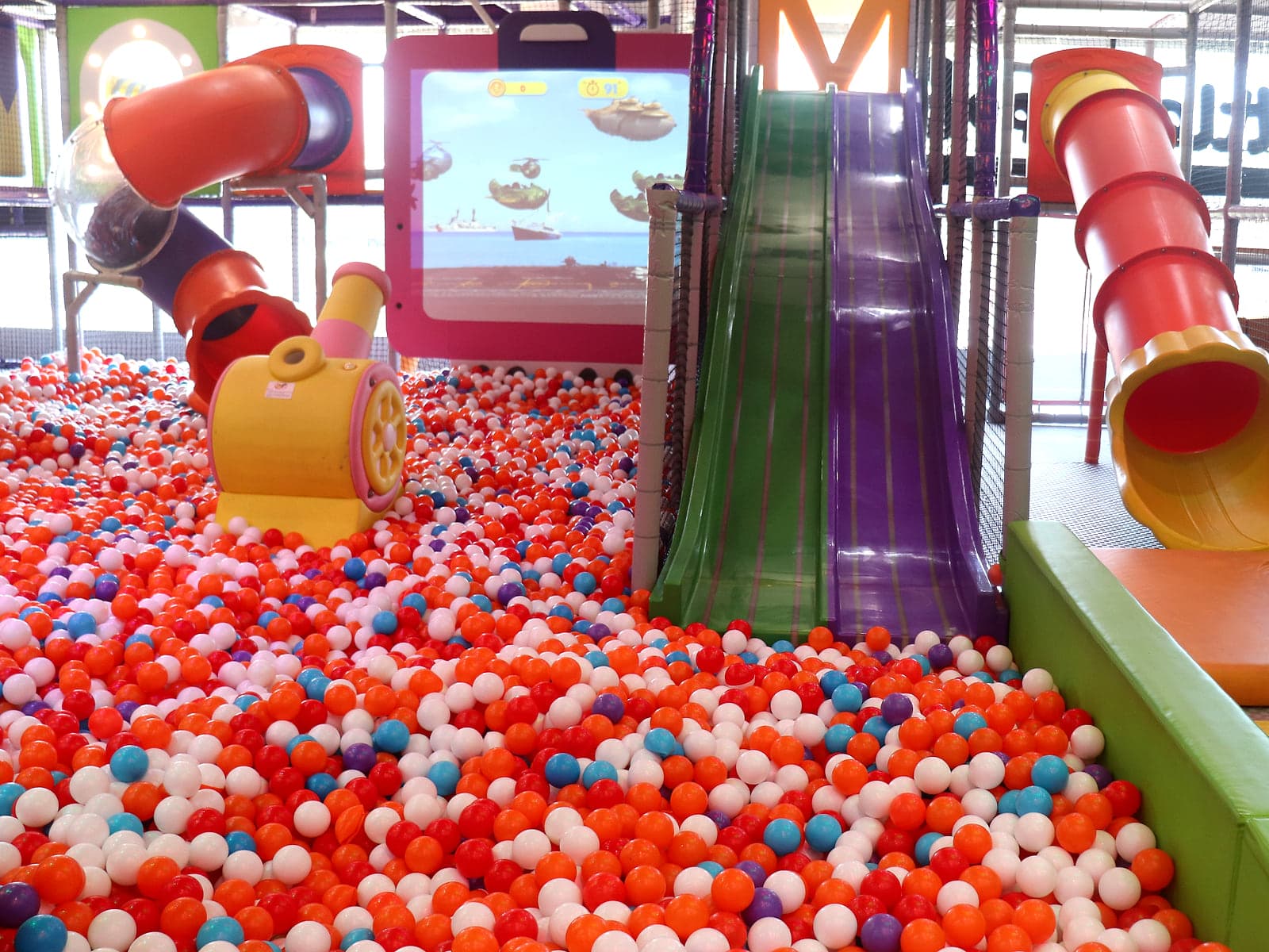 Giant ball pool with twin slides at the Little Peppe indoor play zone in Aluva